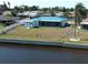 Property featuring backyard, shed, screened lanai, canal, and waterfront access at 6422 Otis Rd, North Port, FL 34287