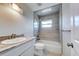 Bathroom with tub and shower combination, modern fixtures, and granite countertop at 6422 Otis Rd, North Port, FL 34287