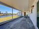 Covered patio area with a view of the backyard, the canal, and waterfront neighborhood at 6422 Otis Rd, North Port, FL 34287
