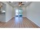 Bright dining area with wood-look flooring and sliding door access to a screened-in patio, perfect for dining at 6422 Otis Rd, North Port, FL 34287