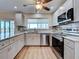Kitchen featuring stainless steel appliances, granite countertops, and light gray cabinetry at 6422 Otis Rd, North Port, FL 34287