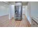Spacious stainless steel refrigerator in the kitchen with hardwood flooring at 6422 Otis Rd, North Port, FL 34287