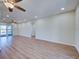 Spacious living room with hardwood flooring and a view to an outdoor patio at 6422 Otis Rd, North Port, FL 34287
