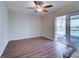 Bright living room with hardwood flooring and access to an outdoor patio at 6422 Otis Rd, North Port, FL 34287