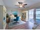 Bright office with hardwood flooring and access to an outdoor patio overlooking a water view at 6422 Otis Rd, North Port, FL 34287
