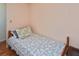 Comfortable bedroom featuring a twin bed with a patterned comforter and soft pillows at 6451 Keena Ct, North Port, FL 34287