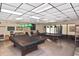Billiards room with two pool tables, overhead lighting, and seating, creating a recreational space at 6451 Keena Ct, North Port, FL 34287