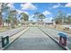 Enjoy outdoor recreation with this bocce ball court featuring seating and well-maintained playing surface at 6451 Keena Ct, North Port, FL 34287