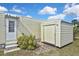 This property has a useful storage shed and is adjacent to a door and steps at 6451 Keena Ct, North Port, FL 34287