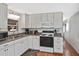 Functional kitchen with white cabinets, modern appliances, and a convenient layout for cooking at 6451 Keena Ct, North Port, FL 34287