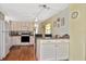 Bright kitchen with ample cabinet space, modern appliances, and an adjacent dining area at 6451 Keena Ct, North Port, FL 34287