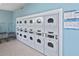 Well-maintained laundry room featuring multiple washers and dryers for residents at 6451 Keena Ct, North Port, FL 34287