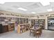 A community library has bookshelves filled with books, a table for reading, and a quiet ambiance at 6451 Keena Ct, North Port, FL 34287