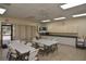 Community meeting room offering tables, chairs, and amenities for gatherings at 6451 Keena Ct, North Port, FL 34287