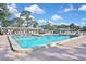 Beautiful community pool with plenty of seating and shade for a relaxing experience at 6451 Keena Ct, North Port, FL 34287