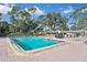 Community pool surrounded by lounge chairs for relaxation and enjoyment at 6451 Keena Ct, North Port, FL 34287