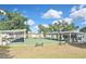 Multiple shuffleboard courts are shaded and ready for play with ample seating for players and spectators at 6451 Keena Ct, North Port, FL 34287