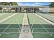 Well-maintained shuffleboard courts marked for scoring, offering a fun and social recreational activity at 6451 Keena Ct, North Port, FL 34287