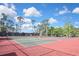 Well-maintained tennis courts surrounded by lush greenery, perfect for sports and recreation at 6451 Keena Ct, North Port, FL 34287