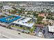 An aerial view of the community with multiple residential buildings, parking and pool at 649 Tamiami S Trl # 106, Venice, FL 34285