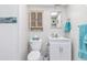 This bathroom features bright natural light, toilet, and a single sink with storage at 649 Tamiami S Trl # 106, Venice, FL 34285