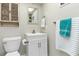 Well-lit bathroom with a stylish vanity and coordinated towel accents at 649 Tamiami S Trl # 106, Venice, FL 34285