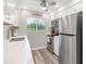 Updated kitchen with stainless steel refrigerator and modern appliances at 649 Tamiami S Trl # 106, Venice, FL 34285