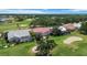 Beautiful aerial view of the home with screened lanai, pool, and golf course in the background at 6507 Drewry'S Blf, Bradenton, FL 34203