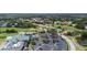 Aerial shot featuring lush golf course views, the clubhouse, and plenty of parking at 6507 Drewry'S Blf, Bradenton, FL 34203