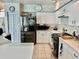 Traditional kitchen featuring stainless steel appliances, tile floors, and a breakfast bar at 6507 Drewry'S Blf, Bradenton, FL 34203