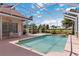 Outdoor living space, showcasing screened lanai with sparkling pool, adjacent seating, and dining area at 6507 Drewry'S Blf, Bradenton, FL 34203