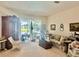Bright living room with large windows and plenty of natural light at 6507 Drewry'S Blf, Bradenton, FL 34203