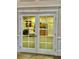 Office with french doors offering a glimpse into an organized administrative office at 6507 Drewry'S Blf, Bradenton, FL 34203