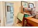 Office space with lots of natural light and a view into the bathroom with tiled walls at 6507 Drewry'S Blf, Bradenton, FL 34203