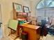 Office area with large desk and storage; boxes present, room flooded with light at 6507 Drewry'S Blf, Bradenton, FL 34203