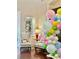 Cozy sitting area with decorative balloons, large window, and high ceilings at 6507 Drewry'S Blf, Bradenton, FL 34203