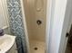 This bathroom has a shower stall with a shower curtain and a sink at 6765 Laurel Ct, North Port, FL 34287