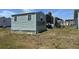View of single-story home exterior and yard with ample outdoor space at 6765 Laurel Ct, North Port, FL 34287