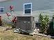 Home exterior with well-maintained AC unit and simple landscaping at 6765 Laurel Ct, North Port, FL 34287