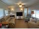Comfortable living room with ceiling fan and plenty of seating at 6765 Laurel Ct, North Port, FL 34287