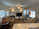 Bright living room featuring neutral walls and lots of seating at 6765 Laurel Ct, North Port, FL 34287