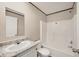 Bathroom featuring a shower-tub combo, a sink with granite countertops, and gray wood-look floors at 6803 Amoko Ct, North Port, FL 34287