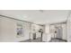 Bright kitchen features stainless appliances, stone counters, a central island and modern wood-look floors at 6803 Amoko Ct, North Port, FL 34287