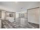 Open floor plan with kitchen view features wood-look floors, and abundant natural light at 6803 Amoko Ct, North Port, FL 34287