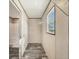 Walk-in closet space with metal shelving and a window for ventilation at 6803 Amoko Ct, North Port, FL 34287