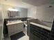 Modern bathroom featuring a tiled shower with a built-in bench and vanity at 751 Arabian Cir, Nokomis, FL 34275
