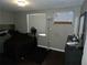 Bedroom featuring a large window with a ceiling fan and a dark colored bed at 751 Arabian Cir, Nokomis, FL 34275