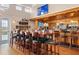 The clubhouse bar is a gathering place for residents, perfect for socializing and enjoying community events at 872 Macaw Cir, Venice, FL 34285