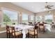 Elegant dining room featuring ample seating, large windows, and a serene view of the community at 872 Macaw Cir, Venice, FL 34285