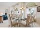 Open concept dining area with ample seating, arched windows, and neutral decor at 872 Macaw Cir, Venice, FL 34285